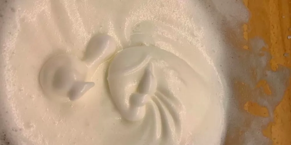 A bowl of whisked egg white.